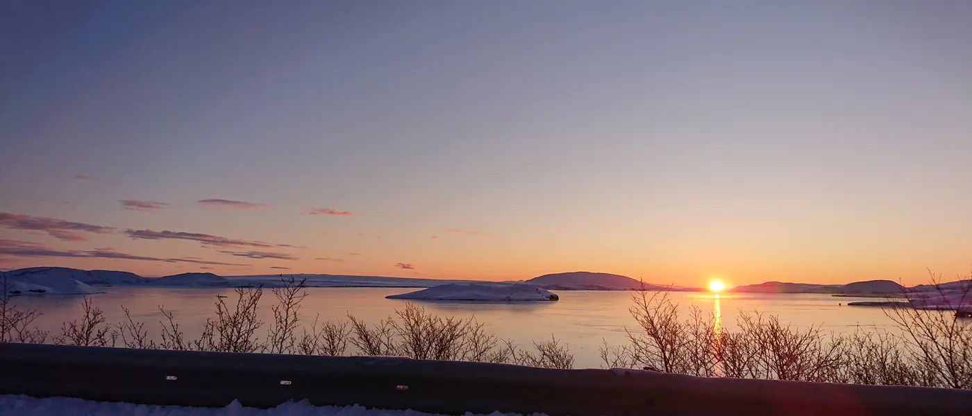 The sun rising over Þingvallavatn, the lake at Þingvellir, on a January morning